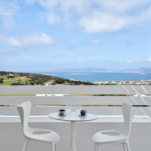 Spend mornings with hot coffee overlooking the sparkling Aegean Sea