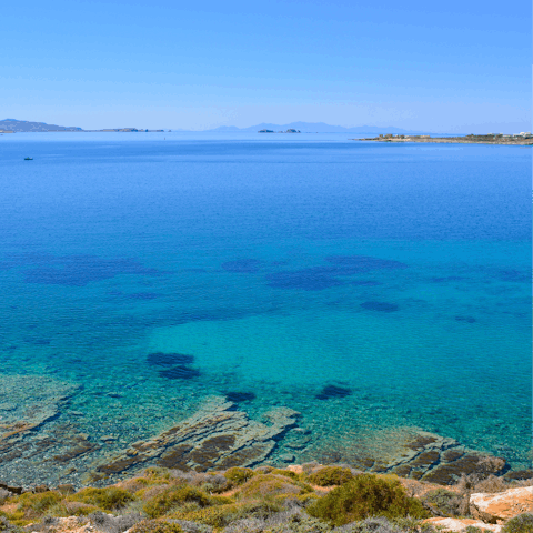 Spend a day in the crystal waters of Alyki Beach, a short distance from your home