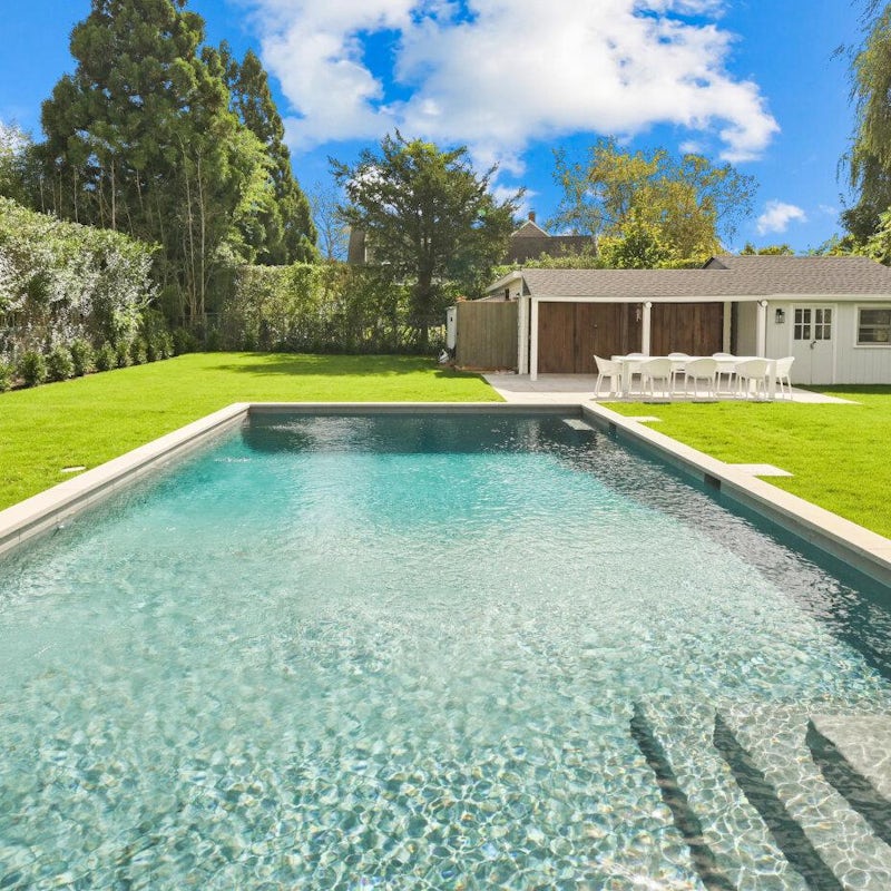Swim laps under the sunshine in the vast private pool
