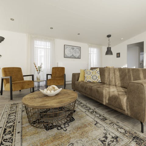 Relax in the cosy living space after an exciting day at the beach