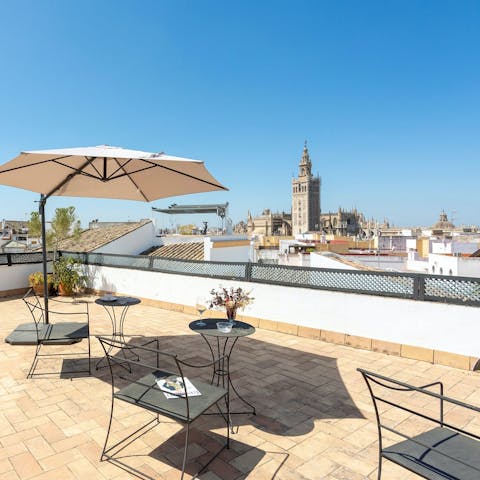 Soak up the Seville sun and city views from the shared roof terrace