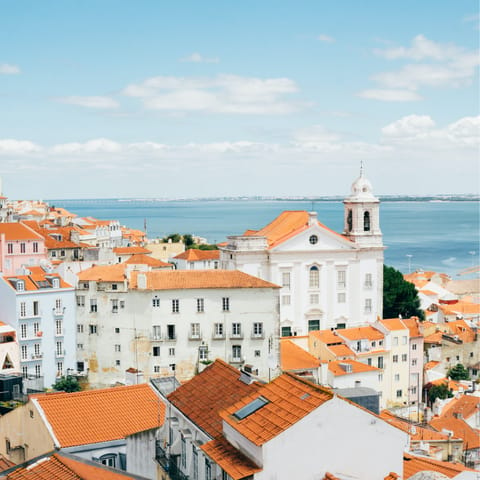 Drive into Lisbon to see the sights, shop, and sip cocktails