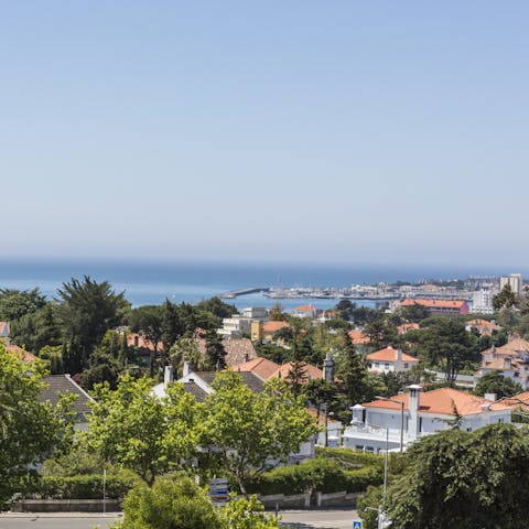 Take in the sweeping views of the Bay of Cascais and Estoril from the veranda