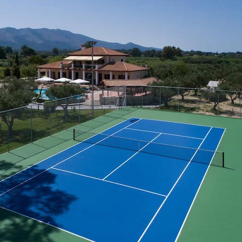 Practise your serve on the private tennis court