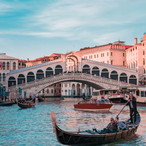 Stroll ten minutes to reach the iconic Rialto Bridge over the Grand Canal