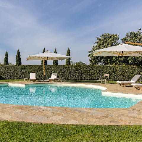 Jump into the communal swimming pool before soaking up the sunshine on a lounger