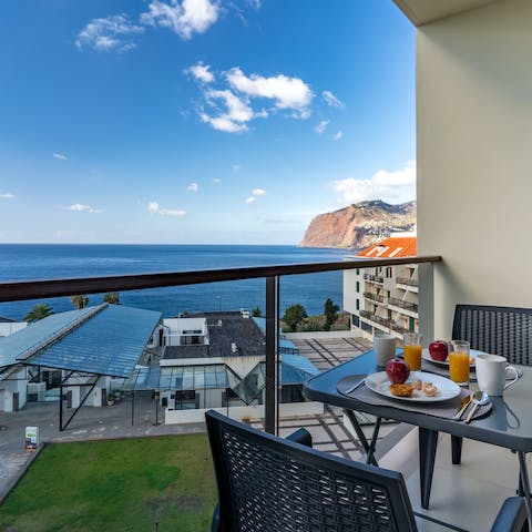Start your day with a leisurely breakfast out on the private balocny, with ocean views before you 