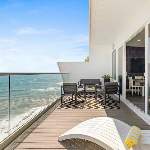 Listen to the sound of the Pacific Ocean from the private balcony