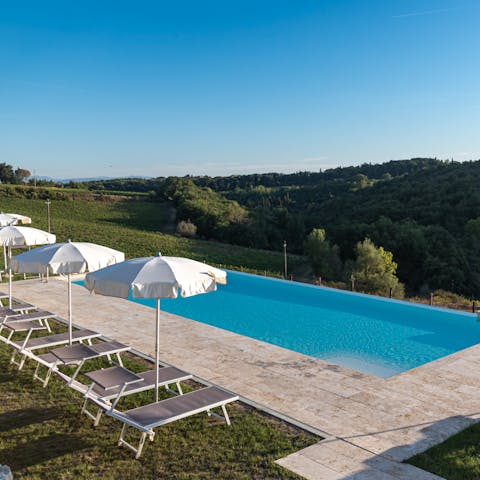 Enjoy beautiful views across Chianti whilst relaxing by the pool