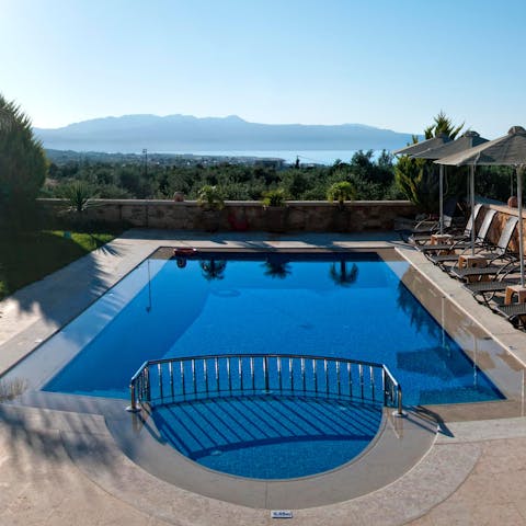 Take a dip in the refreshing swimming pool overlooking the Cretan landscape
