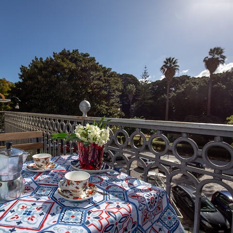 Gaze out at leafy views while sipping a cup of tea from the balcony