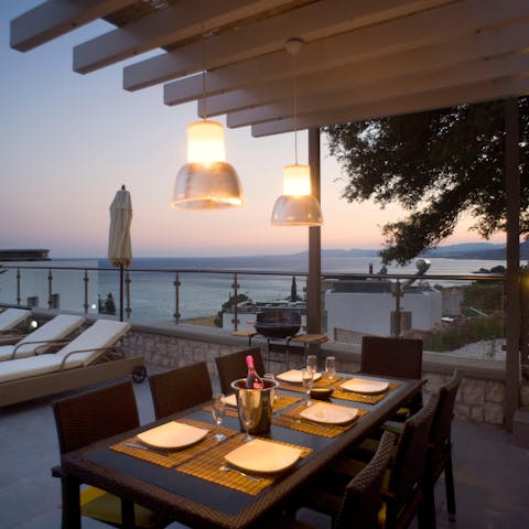 Watch the sunset as you tuck into a delicious Greek-inspired dinner