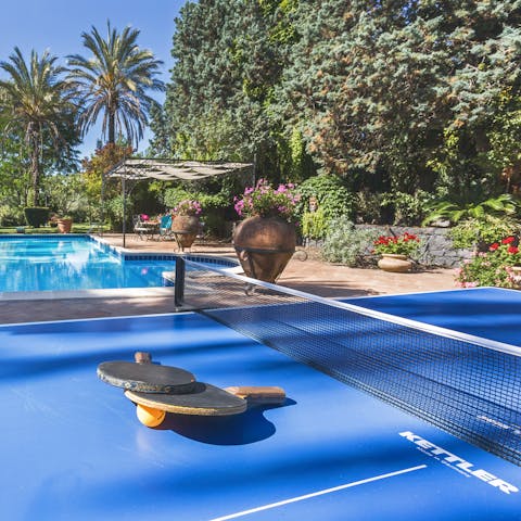 Play a game or two of poolside ping pong surrounded by palms