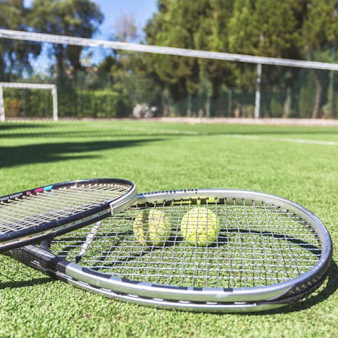 Get competitive with a set or three of tennis on your private, outdoor court