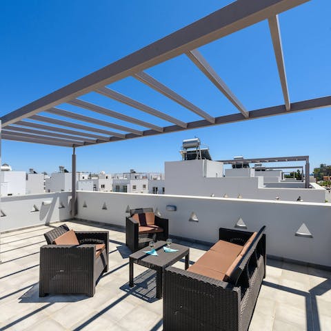 Sip coffee under the pergola and soak up panaromic views from your roof terrace