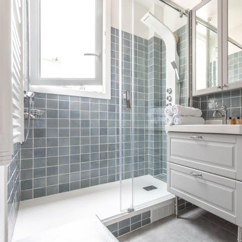 Start mornings with a luxurious soak beneath the bathroom's power shower