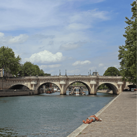 Take a stroll along the banks of the Seine, a twelve-minute walk away