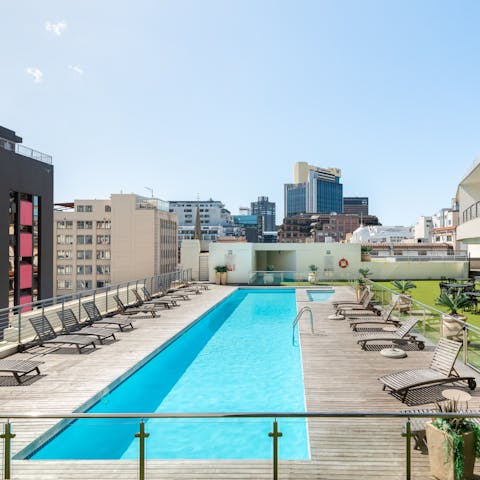 Take a dip in the shared rooftop pool