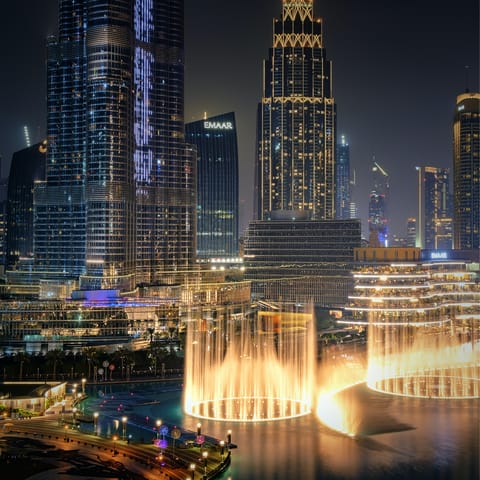 Enjoy a front row seat to the captivating Dubai Fountain light show