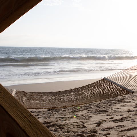 Head down to the shore and while away the day in the hammock