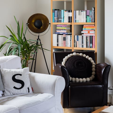 Curl up in the cosy armchair with a book from the host's personal library 