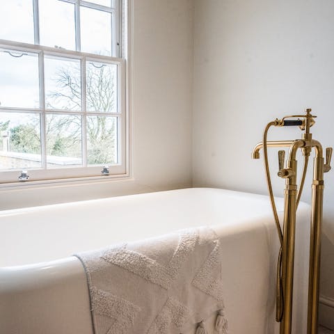Treat yourself to an indulgent bubble bath in the freestanding tub