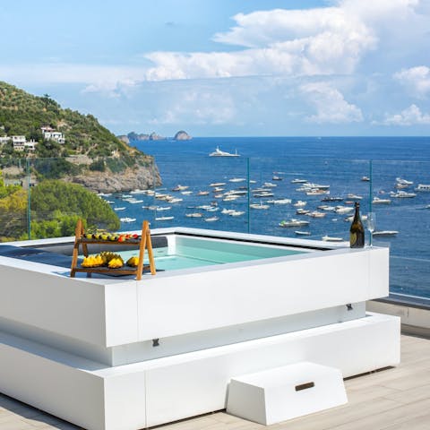 Unwind in the jacuzzi hot tub in front of views over the Mediterranean Sea