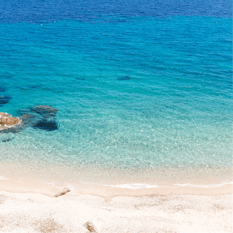 Dive into the crystal clear waters of the Aegean Sea, just 600m away