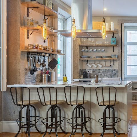Enjoy breakfast at the kitchen bar with its vintage lights