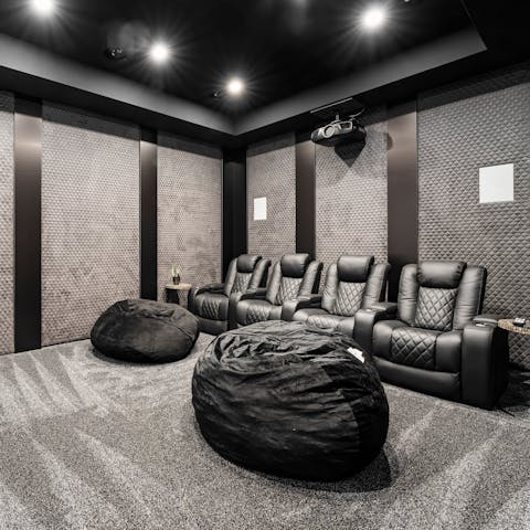 Watch your favourite Hollywood films in the plush home cinema room 