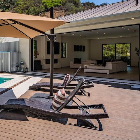 Soak up the California sunshine on the loungers with a cocktail in hand 