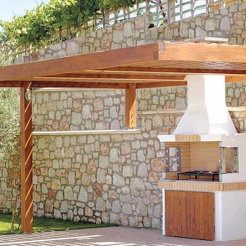Get grilling on the built-in covered barbecue