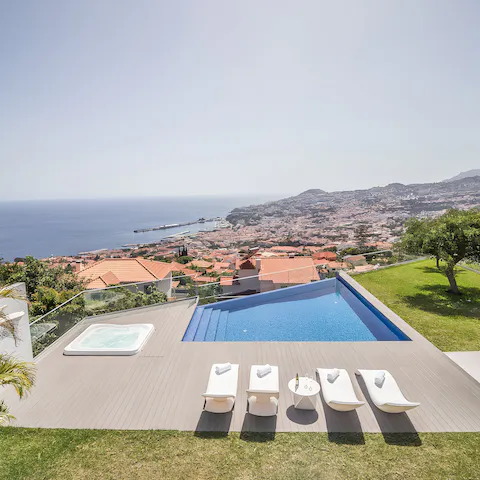 Enjoy sweeping views while relaxing in the pool or jacuzzi
