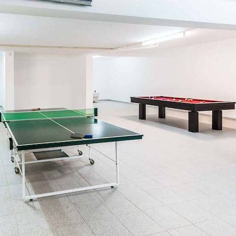 Challenge loved ones to a game of pool or ping pong in the games room
