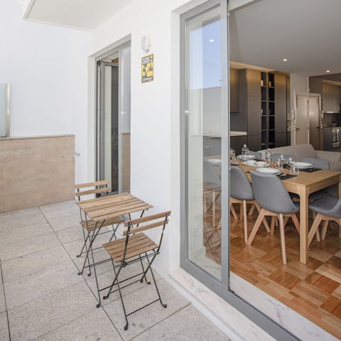 Enjoy an early-evening cocktail on one of the balconies