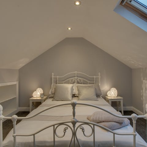 Wake up with the natural morning light in this serene loft bedroom