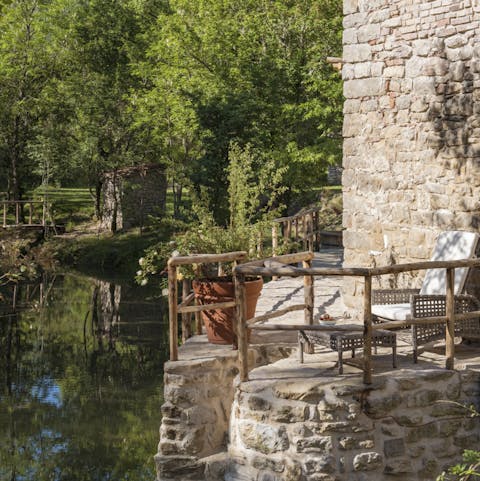 Get lost in a good book by the tranquil stream that runs through the garden