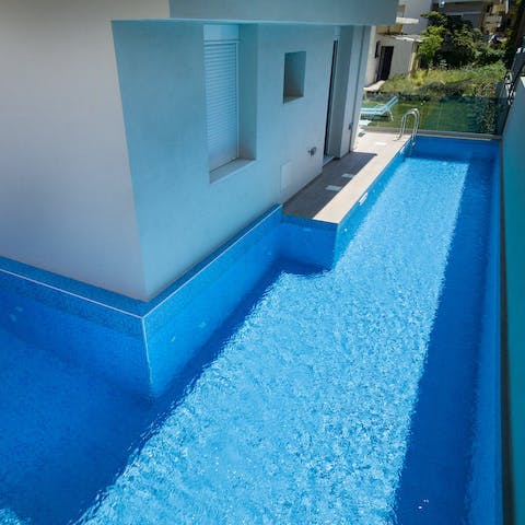 Cool off with a refreshing dip in the L-shaped communal pool