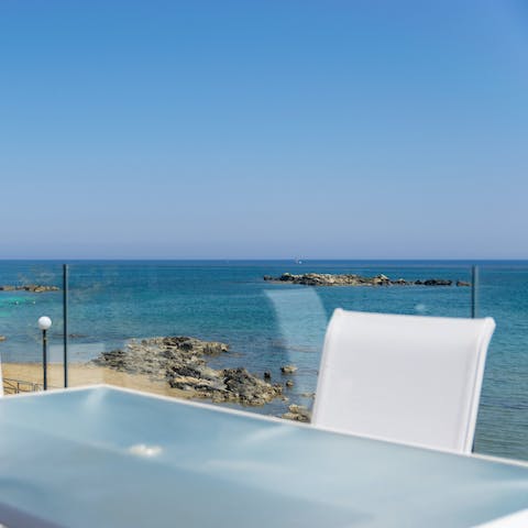 Gaze out across the awesome Aegean Sea from your glass fronted balcony