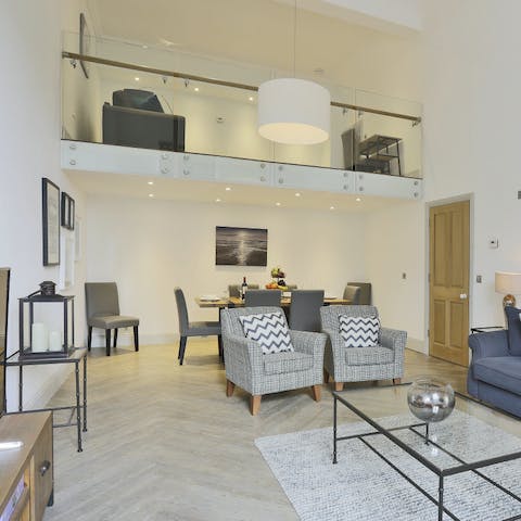 Spread out in the double-height ceiling and mezzanine living area