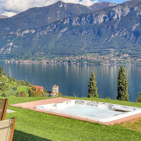 Sink into the luxurious hot tub, pinching yourself at the view of Lake Como, glass of local wine in hand