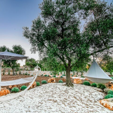 Find a quiet reading spot in the hammock or hanging tent swing