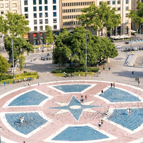 Take five in Plaça Catalunya with a coffee and a spot of people watching