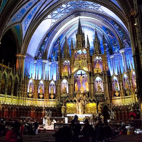 Visit the stunning Notre-Dame Basilica, a fifteen-minute stroll away