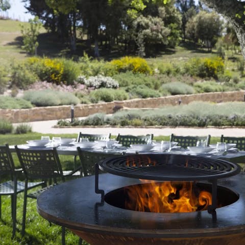 Light a fire and grill seafood for an alfresco lunch