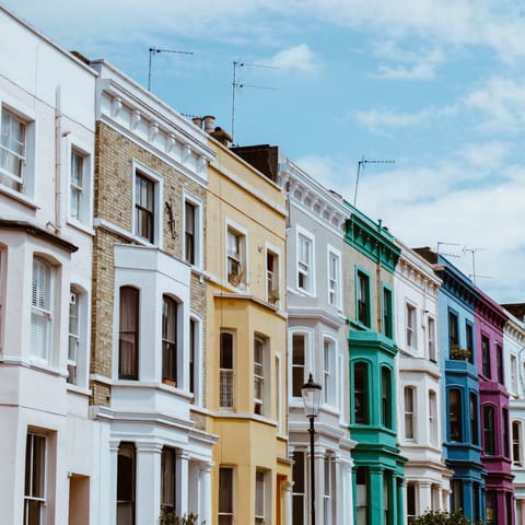 Wander past Notting Hill's colourful townhouses on your way to Portobello Road 