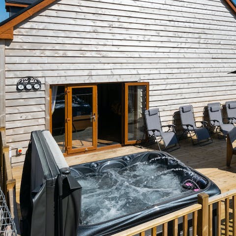 Open a bottle of bubbly and let your cares melt away in your private hot tub