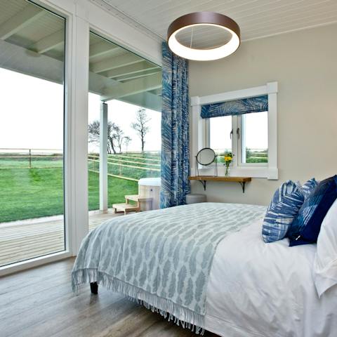 Wake up every morning to the rolling fields of Devon from the foot of your bed
