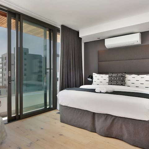 Wake up to balcony views from your comfortable bedroom