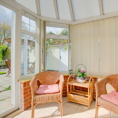 Sip a cup of tea in the sunny conservatory and relax on cane armchairs